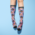 Pair of custom flower socks with colorful patterns and personalized pet photo design