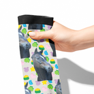 Hand holding custom solo sock with horse photo and colorful lucky charm pattern