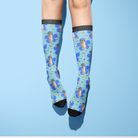 Custom Flower with Stable Snackies Socks featuring colorful pet and snack pattern on blue background
