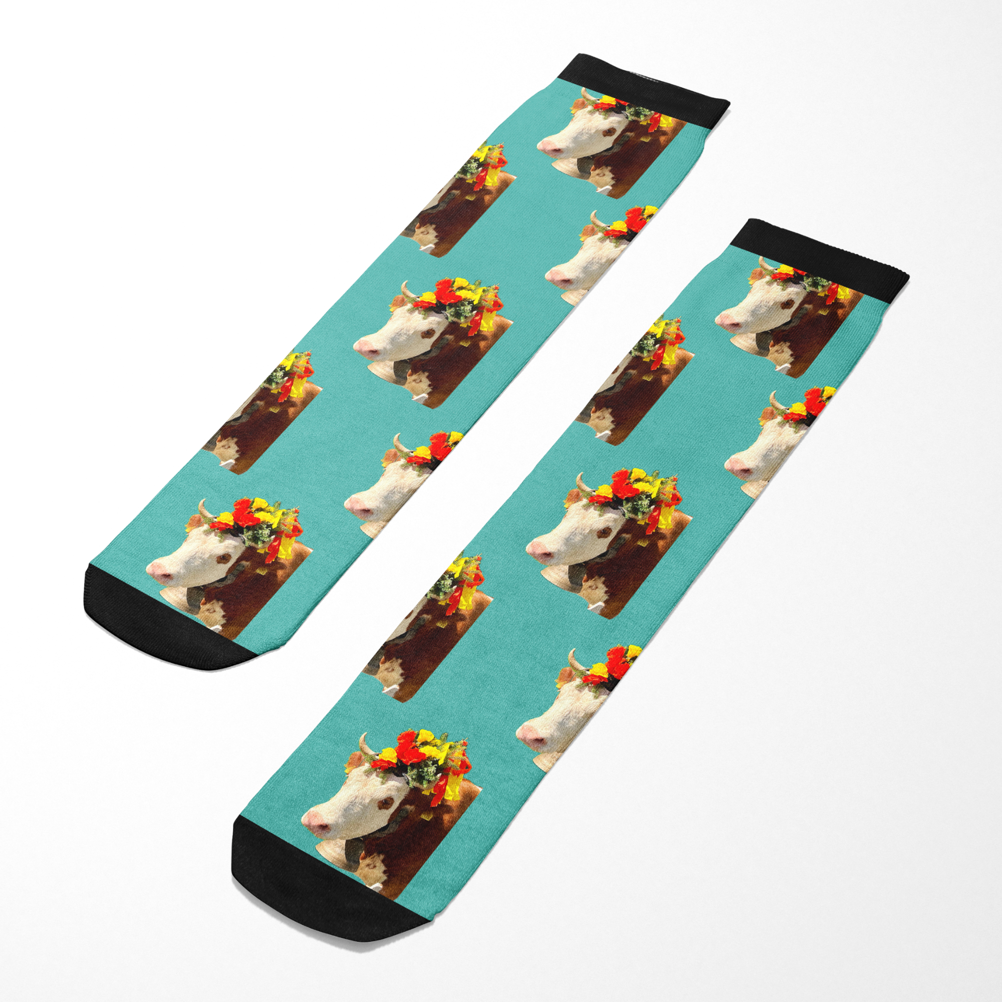 Custom Solo Socks with repeated cow image wearing a flower crown on turquoise background and black accents