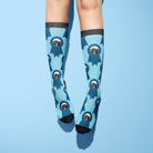 Custom Blue Ribbon Socks with personalized photo on light blue background and black toes and cuffs