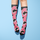 Custom Horseshoe Socks with horse photo and horseshoe pattern on pink background worn on legs