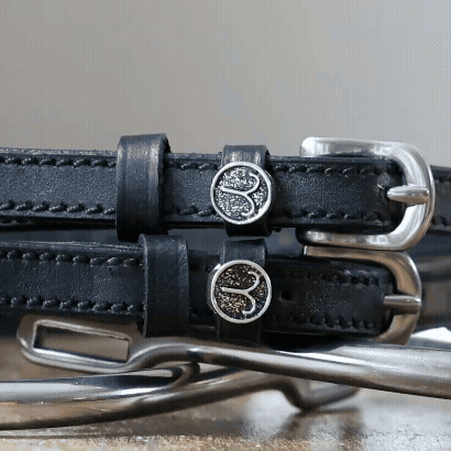 Black leather Aries Spur Straps with stainless steel buckles and custom charms