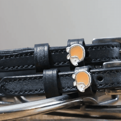 ManeJane Hedgehog Spur Straps Spur Straps — black leather, non-stretch, hero image for English riders.