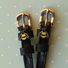 Bee Spur Straps ManeJane black leather spur straps with non-stretch interior and stainless steel buckle for English riding.