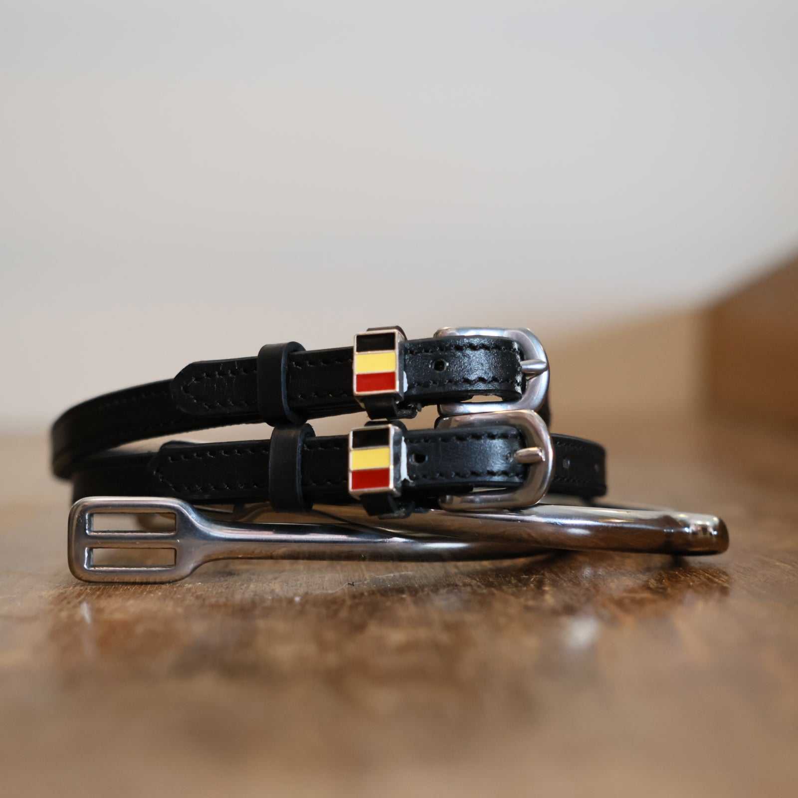 Black leather Belgium Flag Spur Straps with stainless steel buckle and custom charm