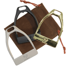 Three polished equestrian stirrup buckles in black, gold, and silver on a brown pouch for horse riding accessories bundle