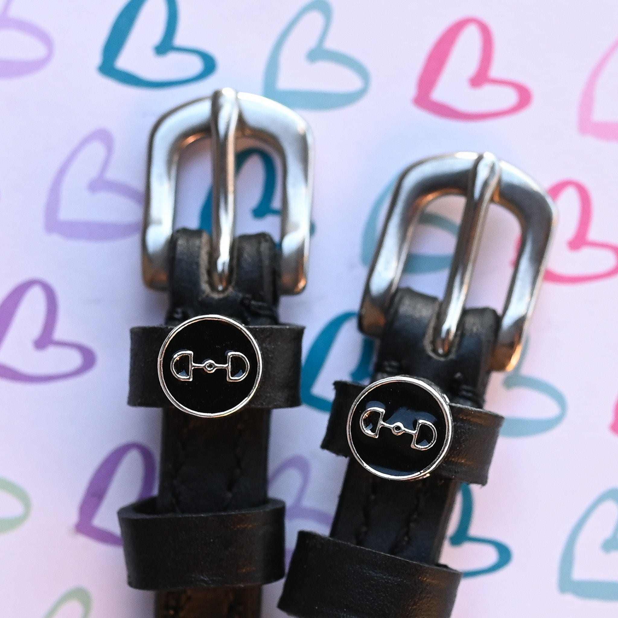 D-Ring Spur Straps ManeJane black leather spur straps with non-stretch interior and stainless steel buckle for English ridi.