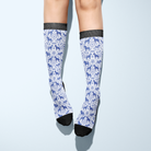 Limited Edition Pony Island Dala Horses Socks with blue folk-art pony pattern on white background and black toes and cuffs