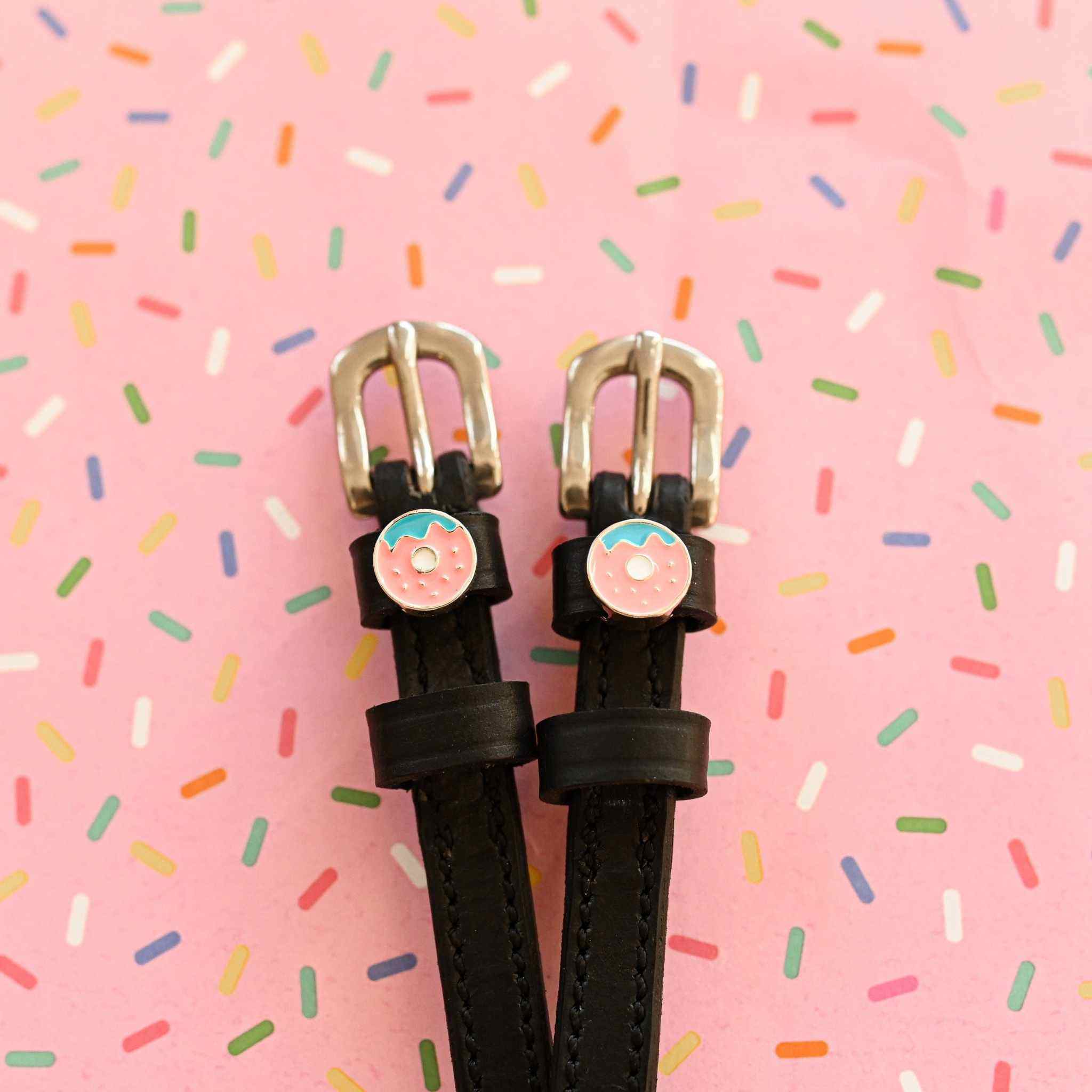 Donutz Equestrian Bundle donut spur straps on pink sprinkles background