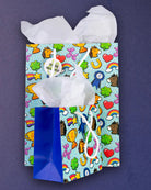 Full O' Luck gift bags in medium and small photographed flat from above, overlapping on a navy ground.