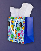 Full O' Luck small gift bag turned right, blue side gusset showing the depth of the square little bag.