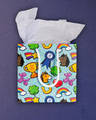 Full O' Luck small gift bag front-on, square aqua panel of horseshoes, hearts and balloon ponies.