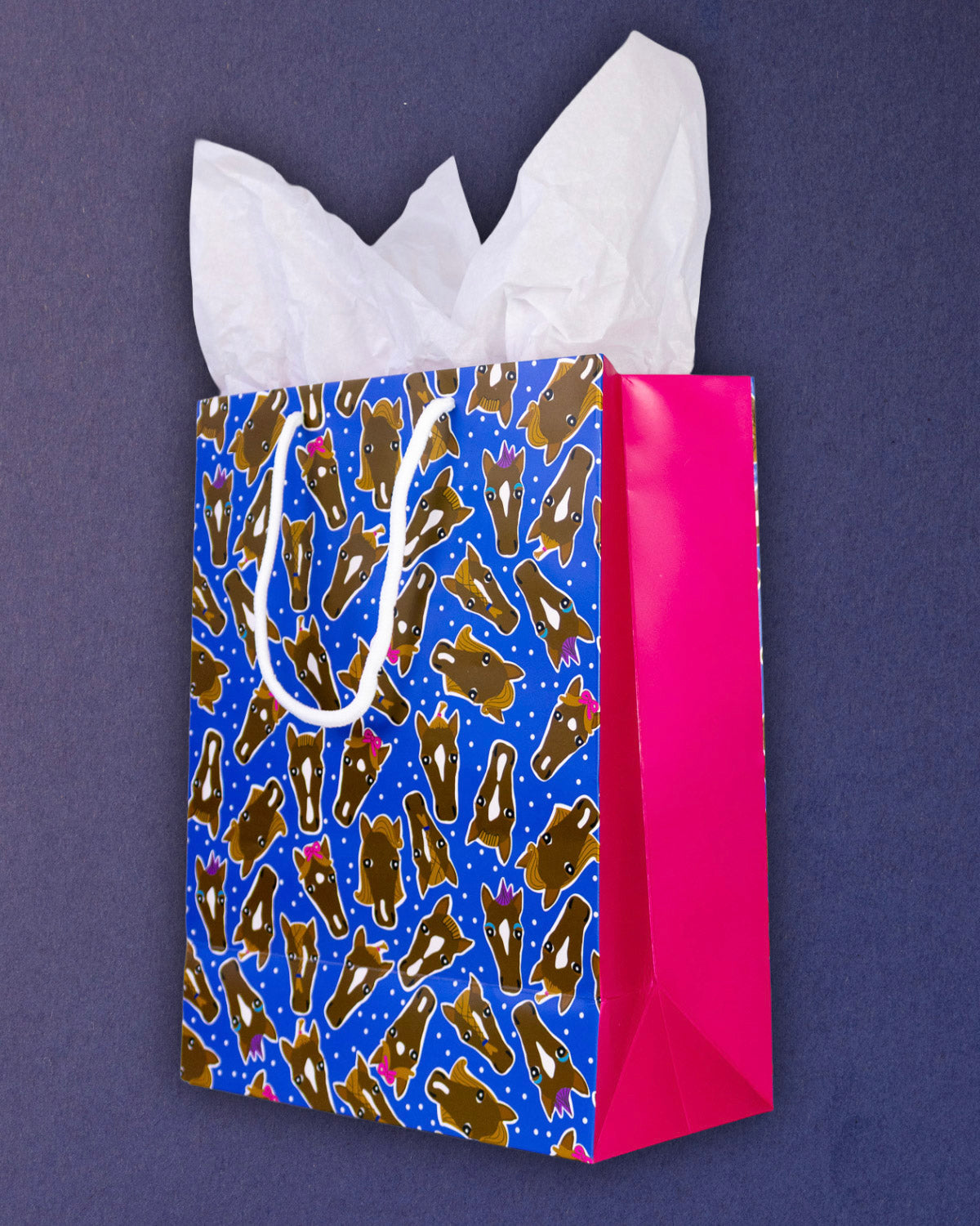 Hairy Styles medium gift bag angled right, blue front panel meeting the hot pink side gusset.