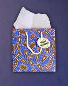 Hairy Styles small gift bag standing front-on, tissue paper above a square panel of horse heads.
