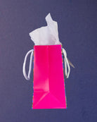 Hairy Styles small gift bag laid on its side, plain pink gusset and base fold filling the frame.