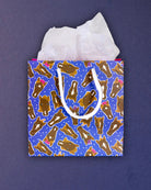 Hairy Styles small gift bag front-on without a tag, blue print of braided and bowed pony faces.
