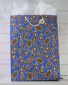 Hairy Styles large gift bag on a white shelf, royal blue panel of horse heads in braids, bows and ponytails.