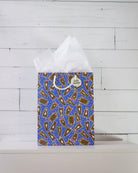 Hairy Styles medium gift bag on a white shelf, blue print of horse heads with different manes and bows.