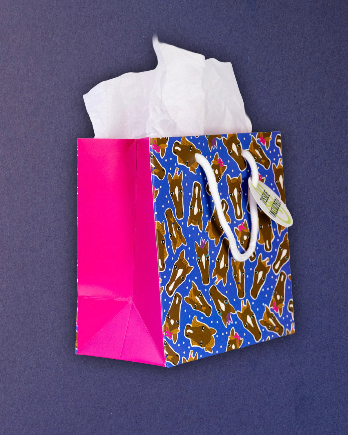 Hairy Styles small gift bag angled left, hot pink gusset beside the square blue printed panel.