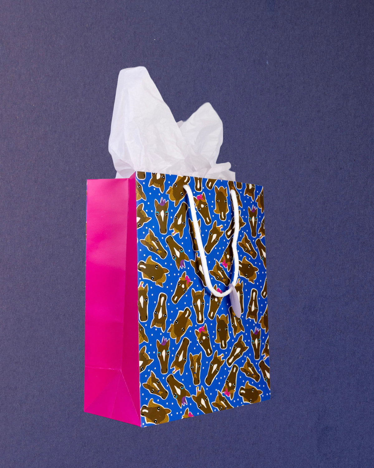 Hairy Styles medium gift bag at three-quarters, pink gusset on the left and horse heads across the front.