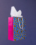 Hairy Styles medium gift bag at three-quarters, pink gusset on the left and horse heads across the front.