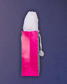 Hairy Styles medium gift bag in side profile, plain pink gusset, folded base and the round hangtag disc.