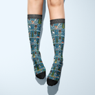 Limited Edition Pony Island Holiday Barn Socks with festive ponies and barnyard design in blue and black accents