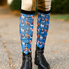 Colorful holiday boot socks with horse patterns, flat seam toe, and terry foot bottom for riding boots