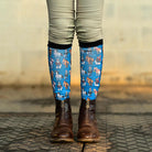 Youth riding boot socks with colorful dog pattern and black top band