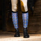 Blue Keep Calm & Dreidel On riding socks with Hanukkah symbols worn with black riding boots