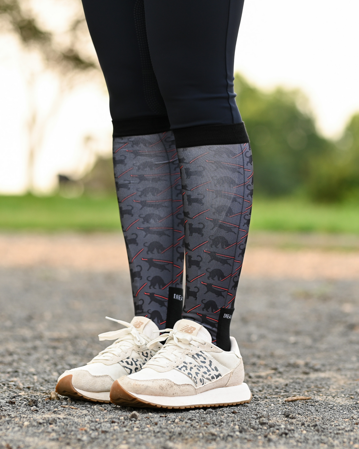 Laser Cats Pair & a Spare boot socks worn on the calf, charcoal with black cats firing red laser beams