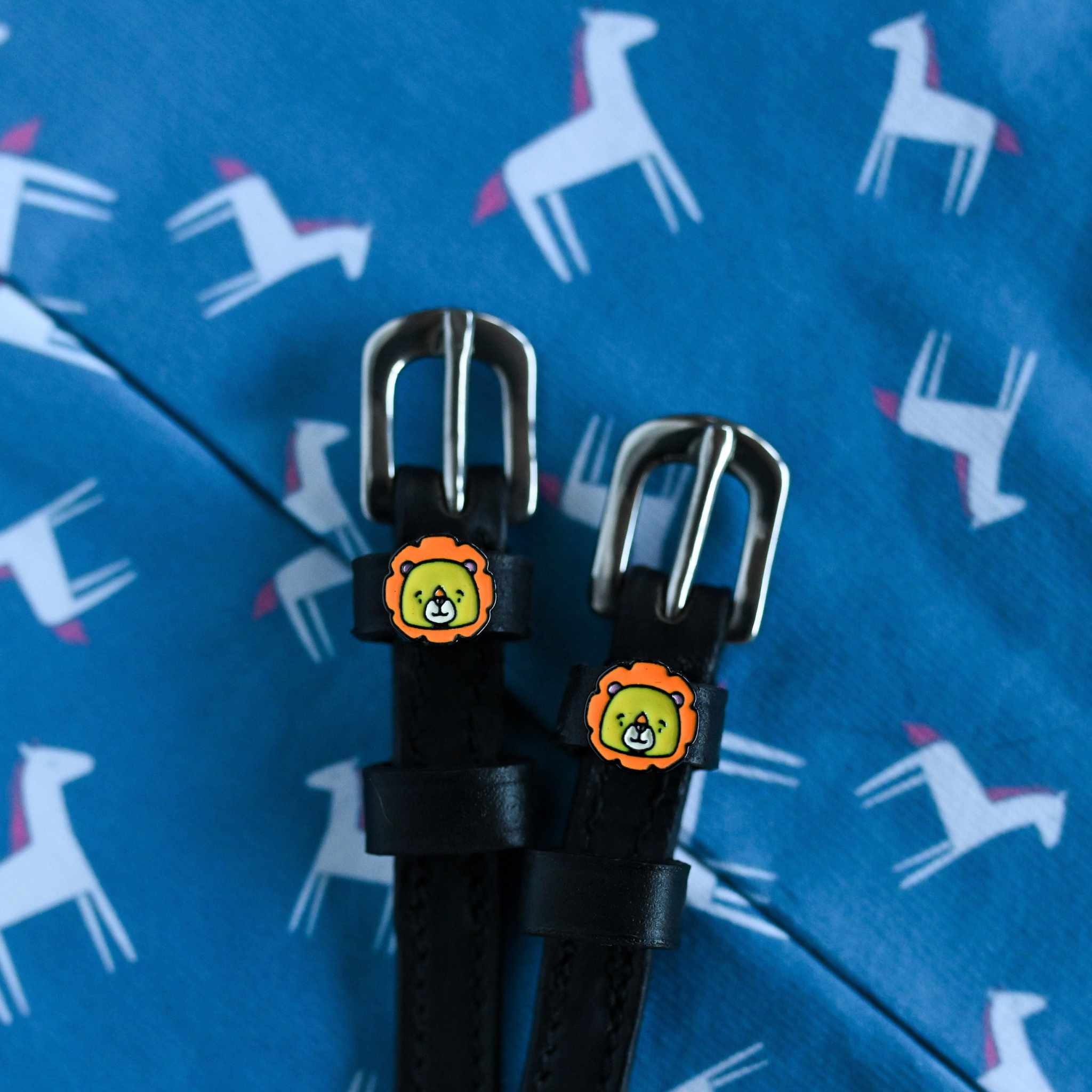 Lion Spur Straps ManeJane black leather spur straps with non-stretch interior and stainless steel buckle for English riding.