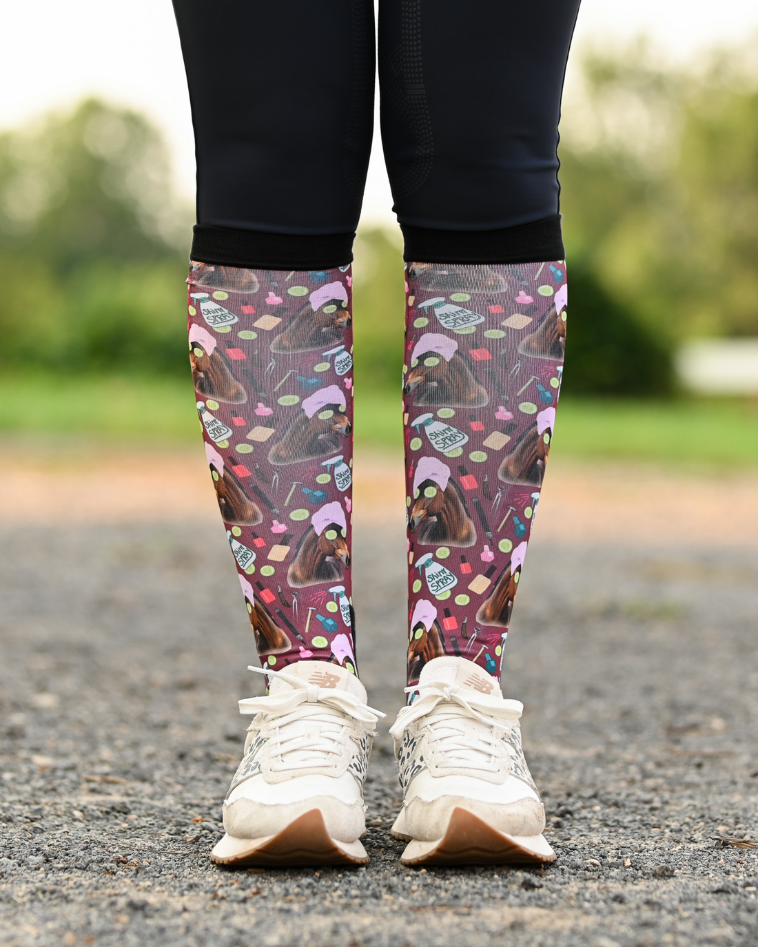 Mani Pedi equestrian boot socks worn at the barn, deep maroon with horses in spa turbans and cucumber slices