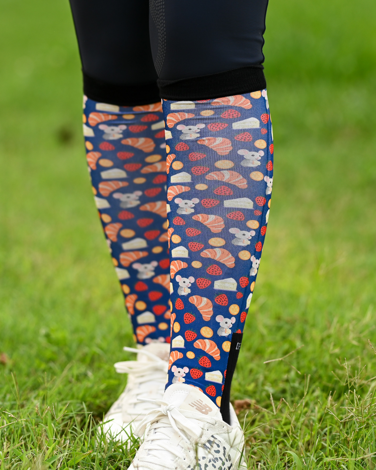 Merci Pair & a Spare boot socks worn on the calf, navy with croissants, macarons and strawberries