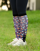 Merci equestrian boot socks worn at the barn, navy with croissants, macarons and strawberries