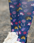 Close crop of the Patch Perfect boot sock print, unicorn, horseshoe and daisy patch badges on navy