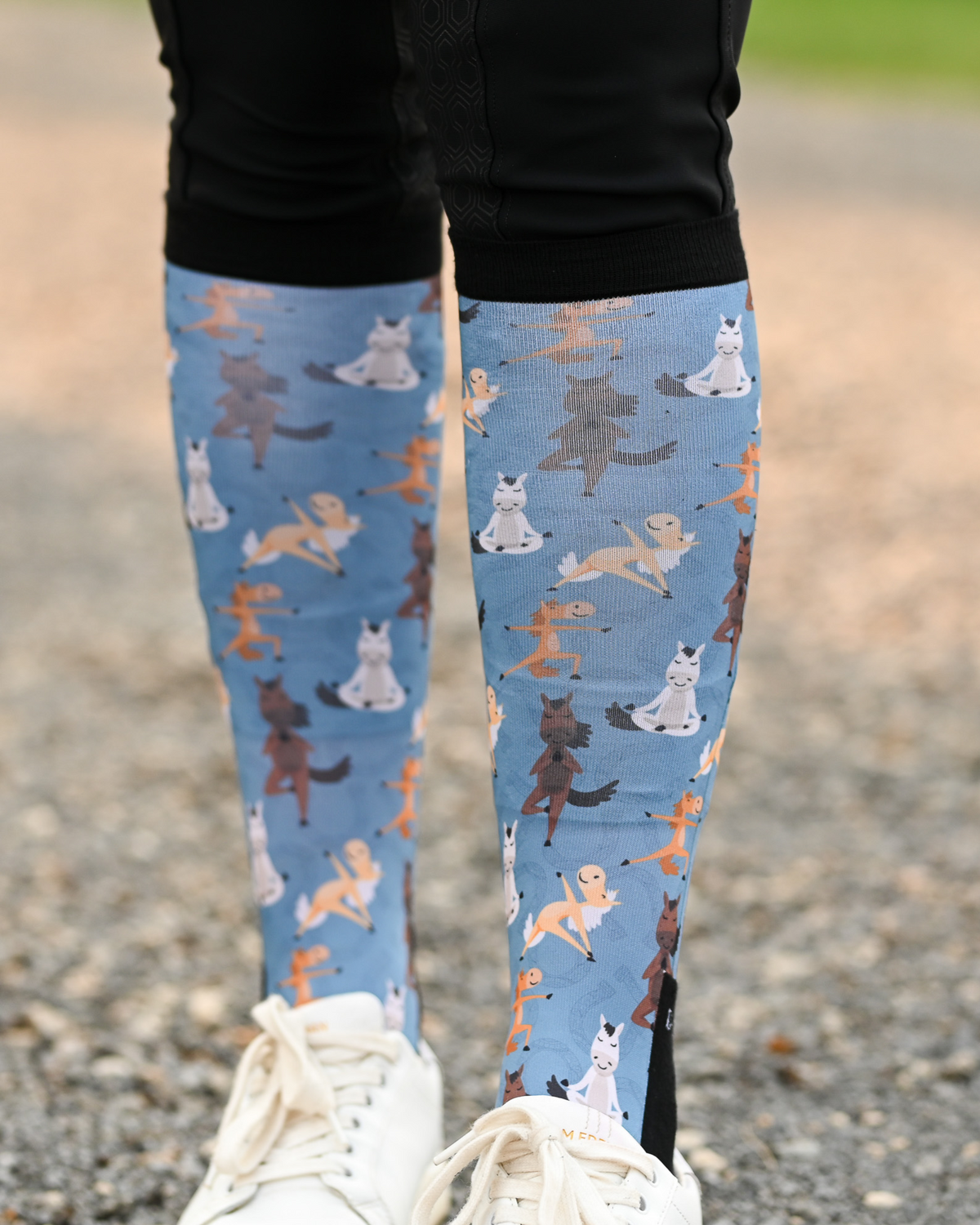 Pony Pilates Pair & a Spare boot socks worn on the calf, soft blue with horses stretching through yoga poses