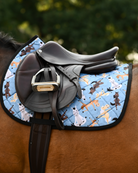 Denim blue Pony Pilates pad under a brown close-contact saddle, cream and tan horses mid-stretch