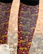 Close crop of the Ready to Play boot sock print, gold leopards, pink lips and bows on burgundy