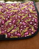 Close view of the Ready to Play print — gold leopards, heart sunglasses and martinis on burgundy