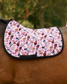 Red Ribbon Girlies saddle pad in light pink, mares with red tail bows, worn unsaddled on a bay horse