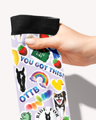 Friendship boot sock held by the black cuff, close-up of You Got This, OTTB, rainbow and rubber duck stickers