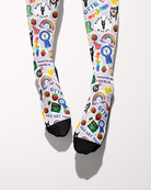 Friendship socks shown from the toes, black toe caps with blue ribbons, strawberries and Ride for Rayas logos