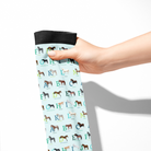 Limited Edition Pony Island Alphabet Horses socks with colorful ABC ponies on light blue background, held in hand