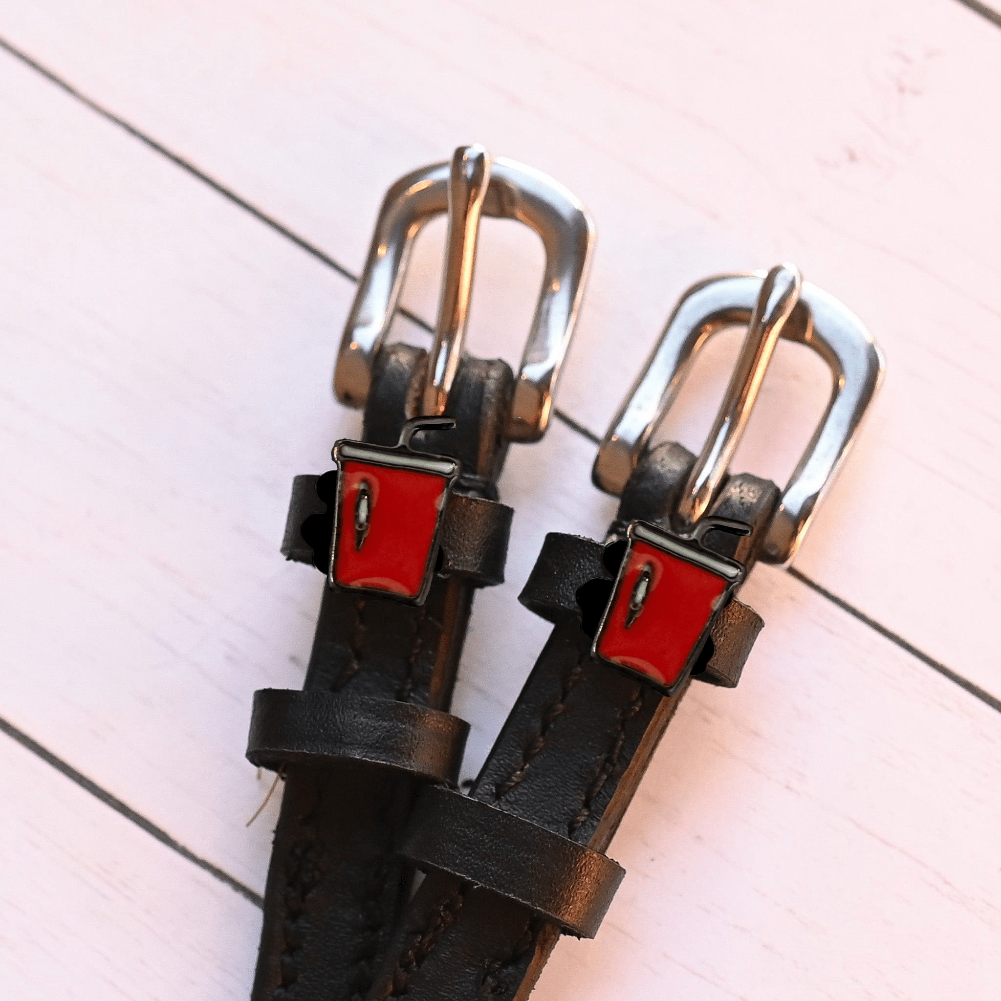 Soda Spur Straps ManeJane black leather spur straps with non-stretch interior and stainless steel buckle for English riding.