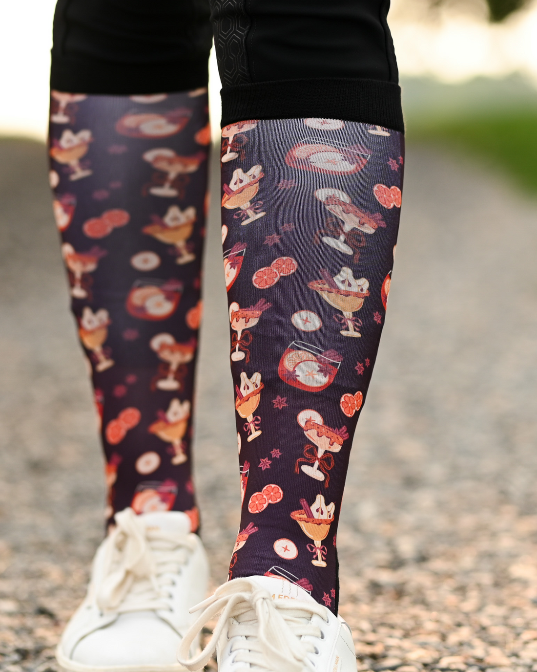 Stir Crazy Pair & a Spare boot socks worn on the calf, dark plum with cocktail glasses and citrus slices