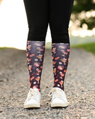 Stir Crazy riding boot socks styled over breeches, dark plum with cocktail glasses and citrus slices