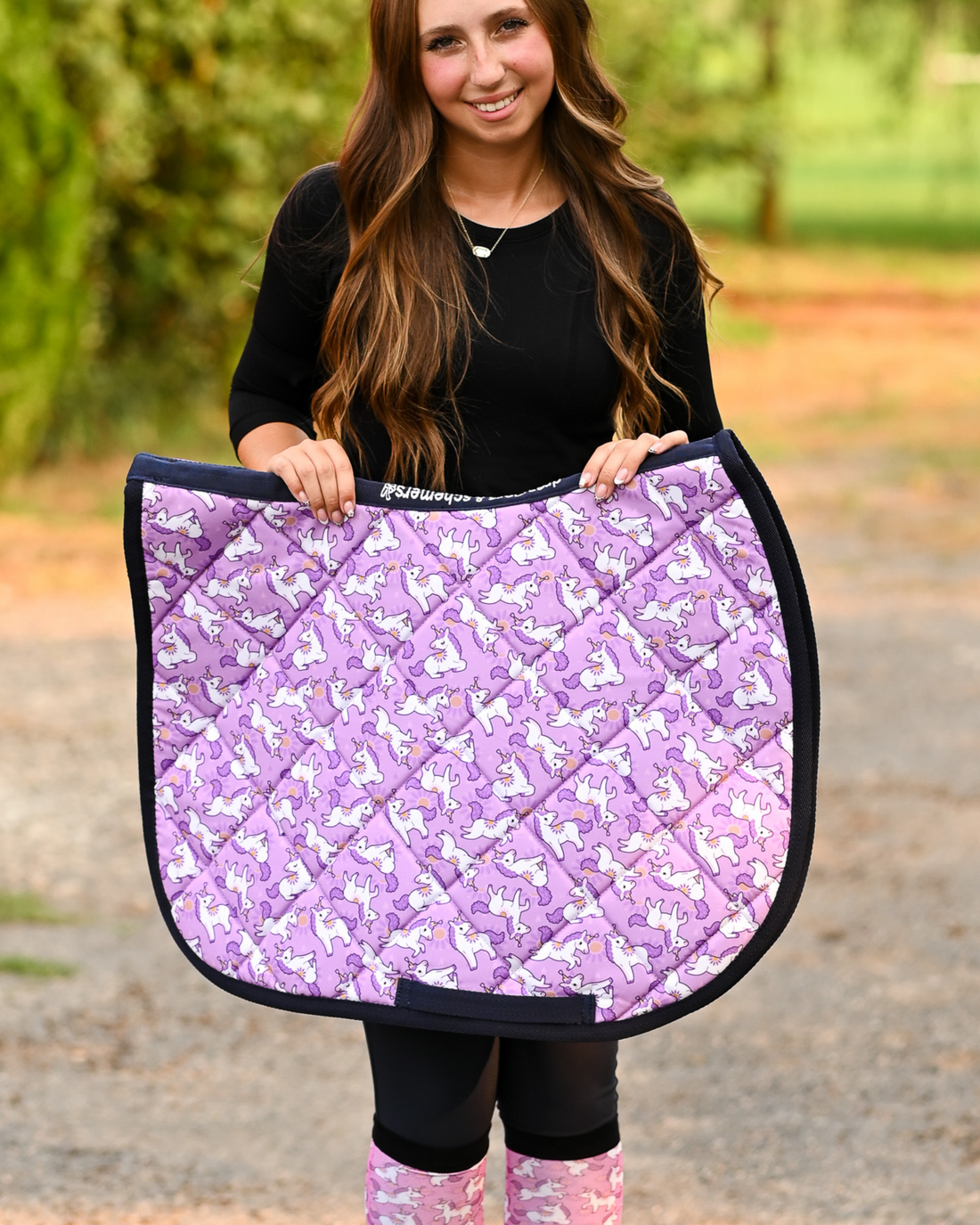 Sunshine & Unicorns all-purpose saddle pad in purple, printed with white unicorns and yellow suns