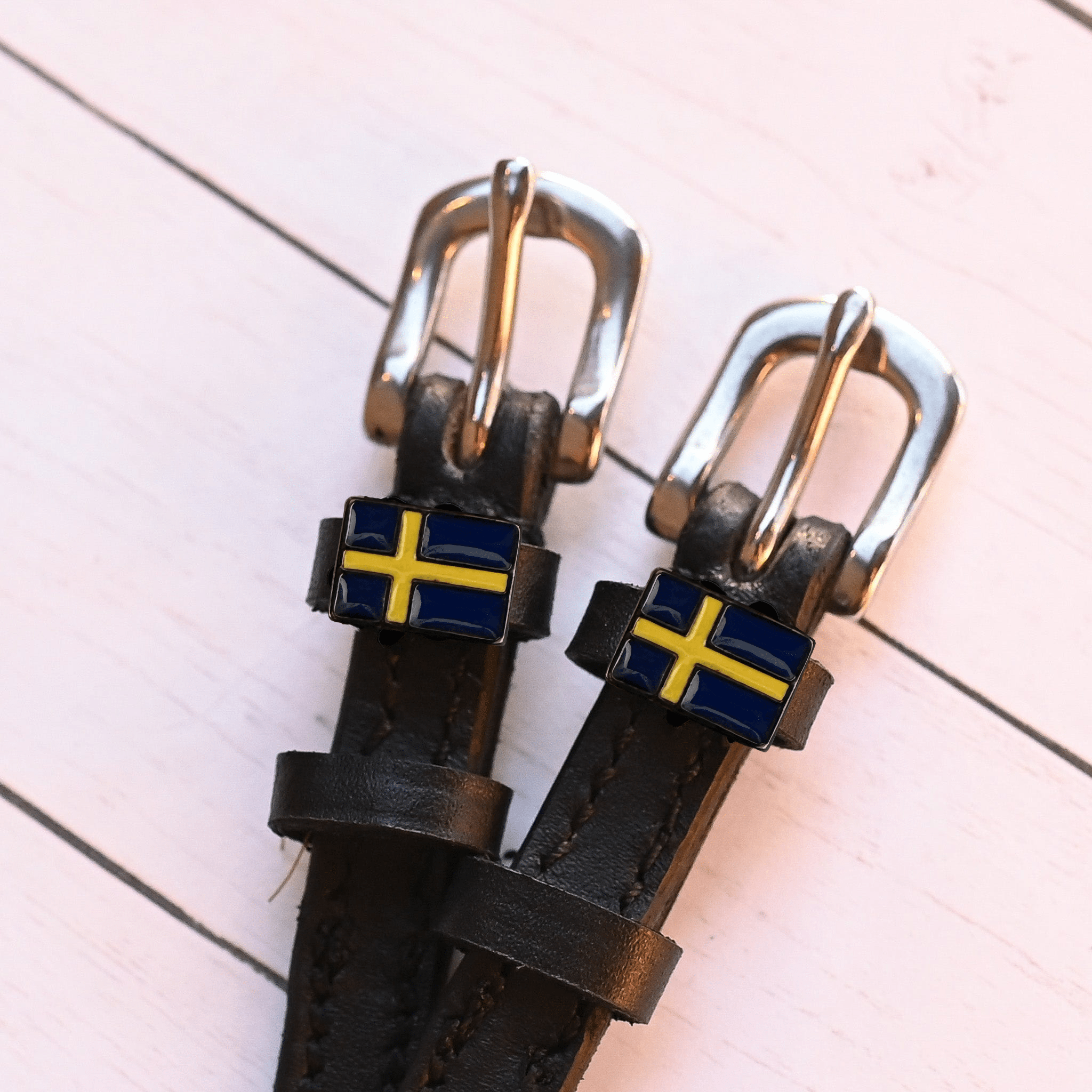 Black leather Swedish flag spur straps with stainless steel buckle and custom charm